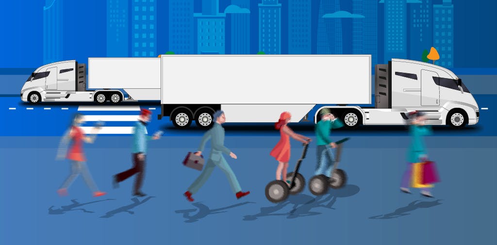 Driverless trucks driving on the road in a city with people. 